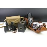 Pair of military binoculars to include a marked 'militaire' set within a green canvas case