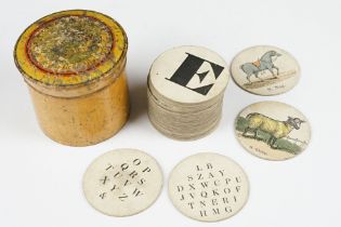 Early 19th century picture alphabet, the discs with letters and hand coloured printed images to