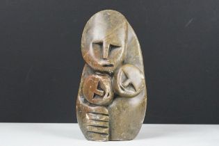 Zimbabwean carved and polished Stone Sculpture of a stylised parent with two children, 18cm high