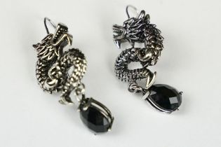 A pair of 925 sterling silver earrings in the form of Chinese dragons with faceted stone drops,