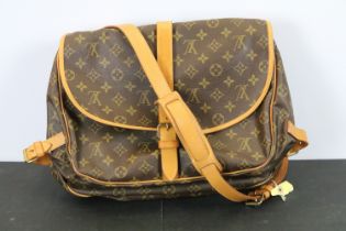 Louis Vuitton - Saumur saddle bag having a monogrammed body with leather straps and canvas lined