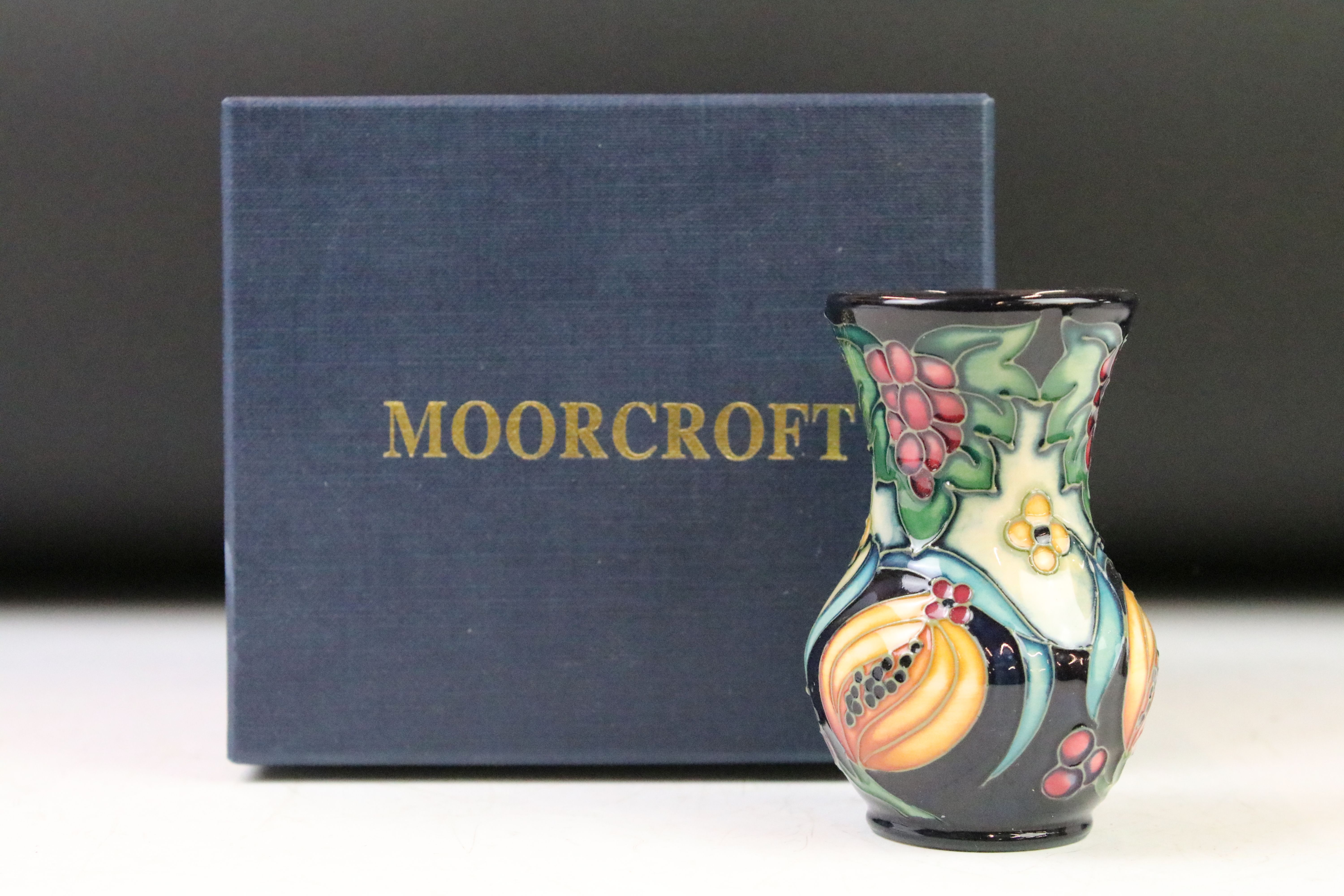 Two boxed Moorcroft pottery vases to include a Celtic Web vase (10.5cm high) and a 'Fruits' - Image 7 of 9