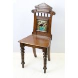 Victorian oak hall chair with Majolica inset tile to back, 90cm high x 44cm wide x 36cm deep