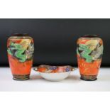 Pair of Japanese Porcelain hand painted Vases decorated in relief with dragons on an orange