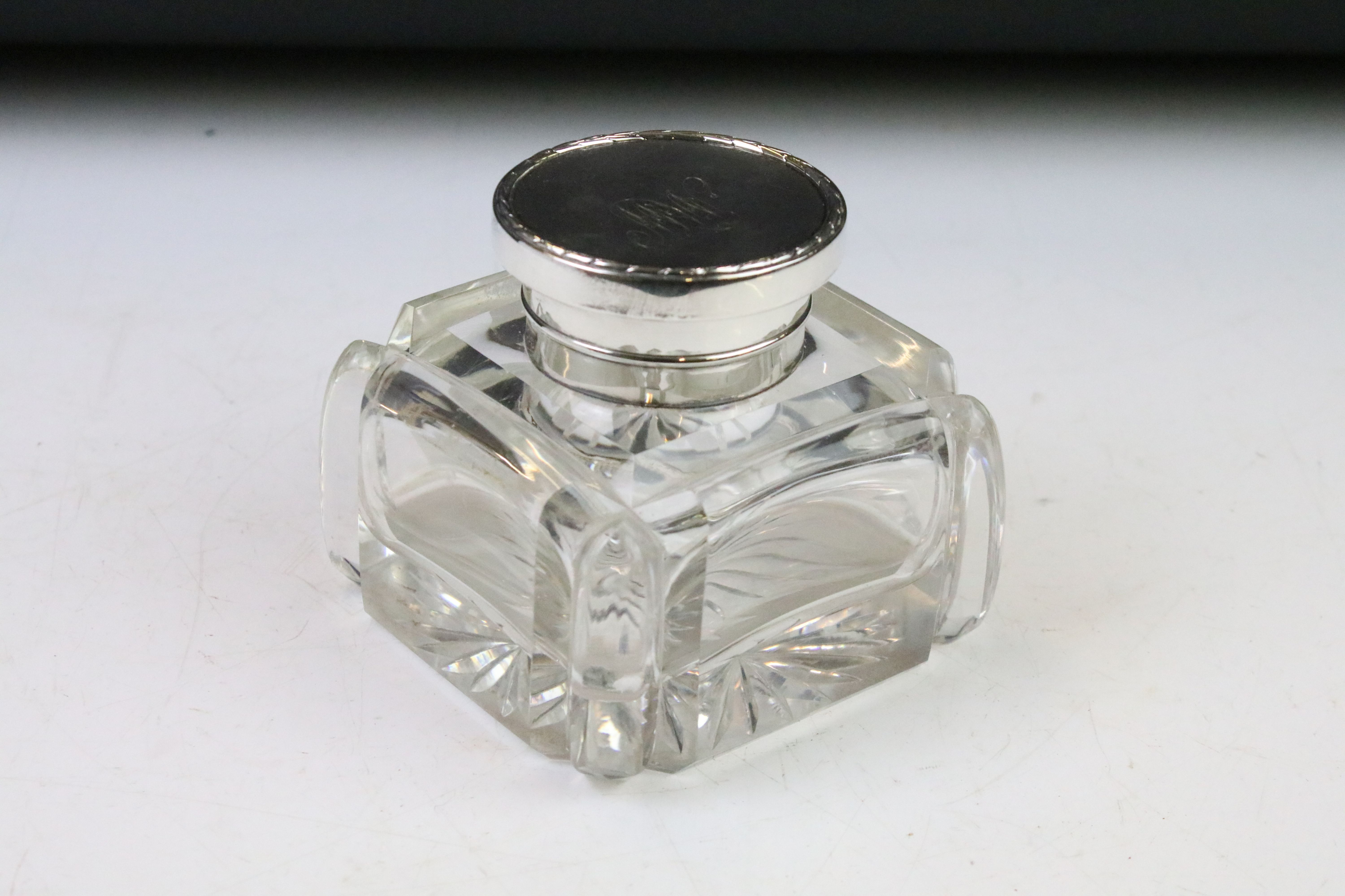 Early 20th century silver lidded glass desk inkwell of square form, with star cut base, approx