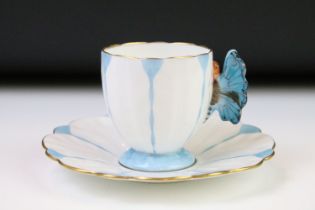 Aynsley Art Deco tea cup and saucer having a butterfly formed handle, gilt rims and blue hand