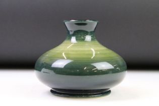 Moorcroft pottery green colour trial vase, with a gradient ground, painted and impressed marks,