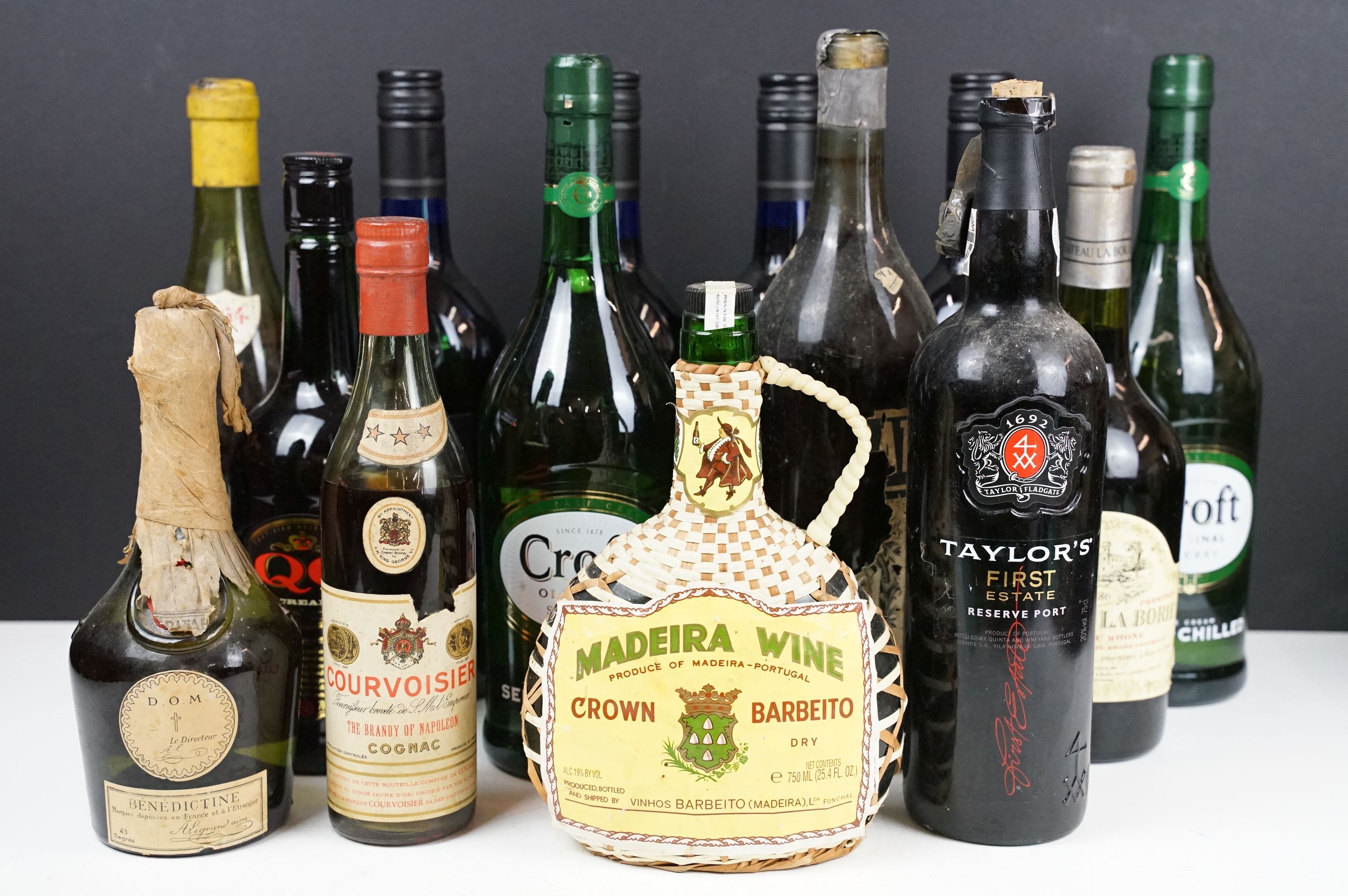 Collection of 14 bottles of wine and spirits to include Harvey's Bristol Cream, Courvoisier, D.O.