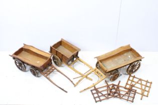 Three scratch built wooden cart models, largest approximately 35cm in length