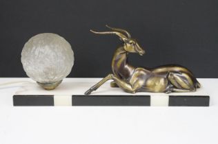 Art Deco Table Lamp mounted with an Antelope and globular glass shade on a marble plinth base,