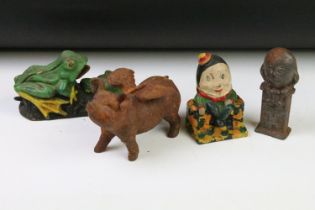 Group of early 20th Century cast iron money boxes to include a flying pig, two humpty dumpty money