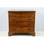 20th century mahogany chest of four long drawers with brushing slide, on bracket feet, 78cm high x