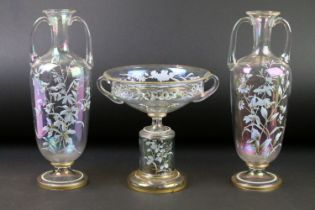 Late 19th / early 20th century iridescent glass three-piece garniture set, with hand painted