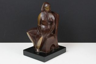 Cast bronze sculpture in the form of a modernist stylised seated figure raised on a plinth base.