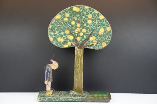 Early 20th century French wooden folk art fruit catching game, the figure with articulated arm. (