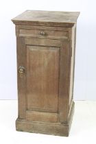 Early 20th Century oak side cupboard having a flared top with drawer beneath having turned knob