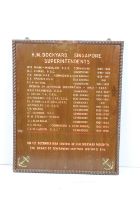 H M Dockyard Singapore 1930s commodore board with painted lettering. Measures 69 x 56cm.