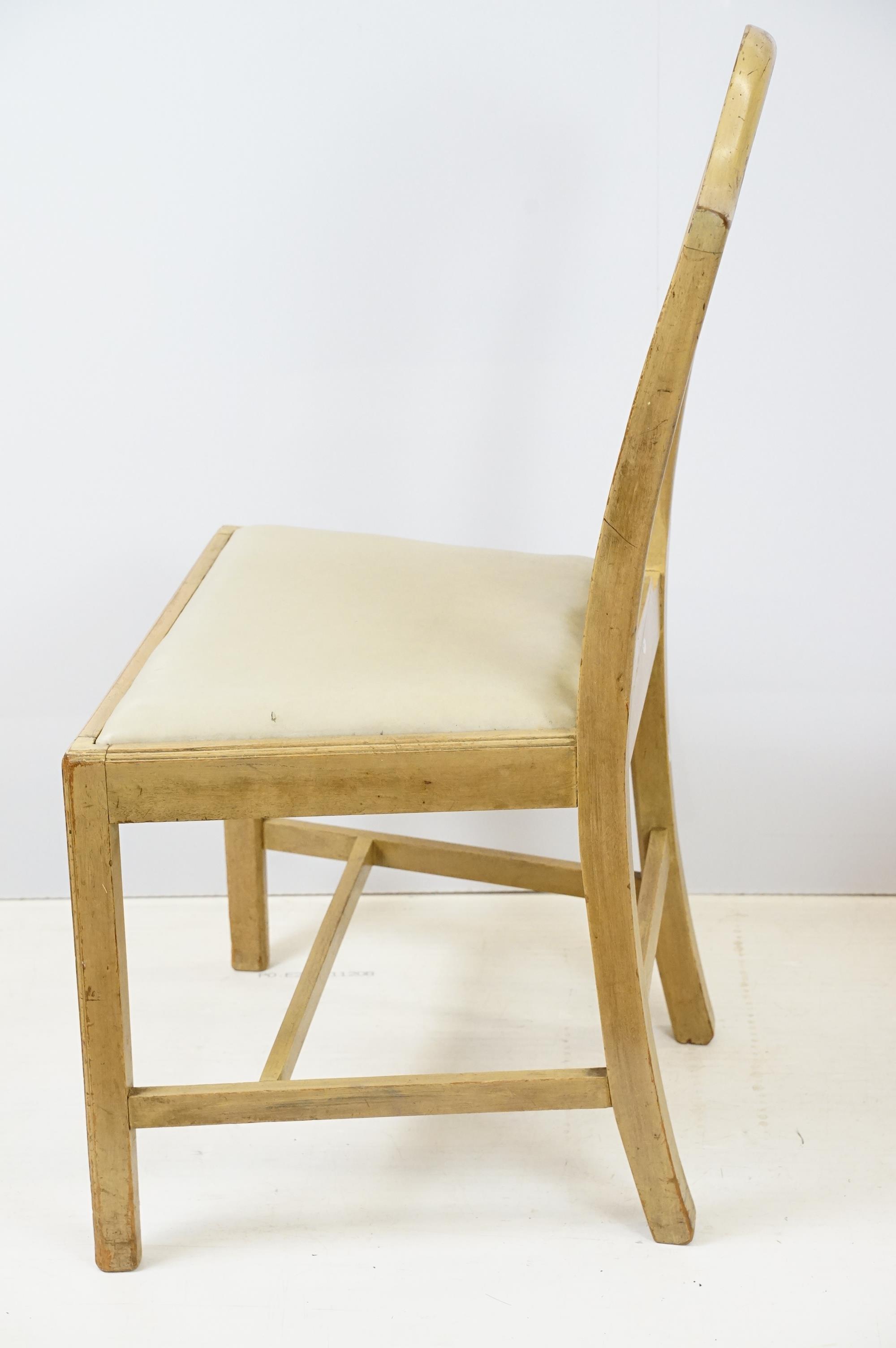 Group of four 20th Century stained oak dining chairs with cream drop in seats. - Image 7 of 9