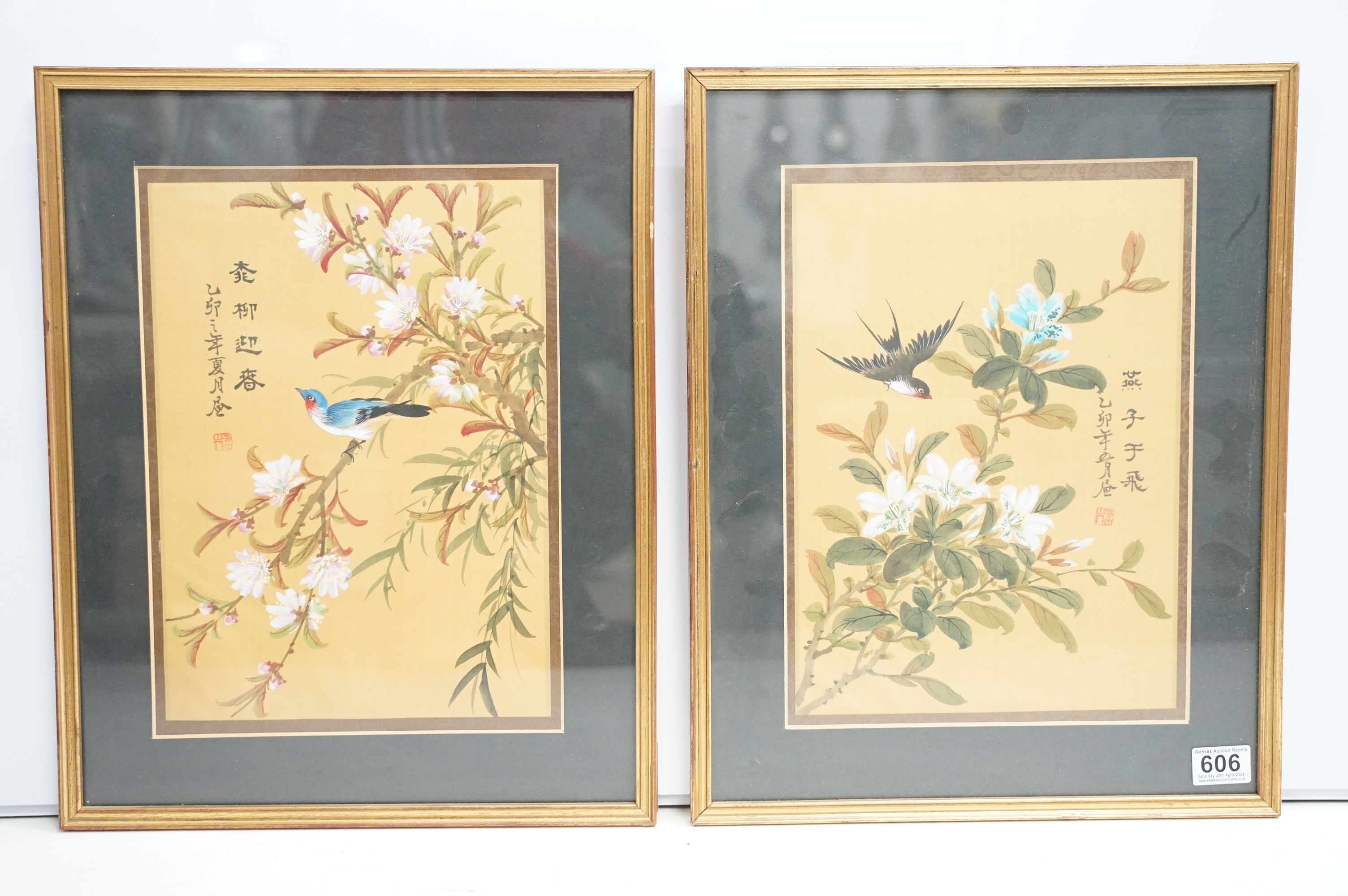 Pair of Chinese paintings on silk depicting birds amongst flowering branches, with character mark