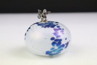 John Ditchfield for Glasform - An iridescent glass paperweight surmounted by a silver fairy,