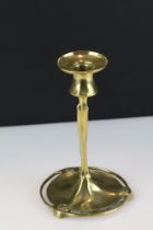 A brass Art nouveau candlestick of classical form