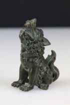 A Chinese ornamental bronze dog of faux statue.