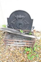 Cast iron fire back with relief crest decoration, together with grate and fireguard, back measures