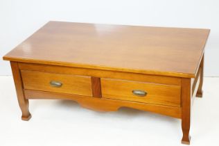 20th Century low coffee table having a rectangular top above a pair of drawers with brass handles