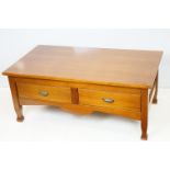 20th Century low coffee table having a rectangular top above a pair of drawers with brass handles