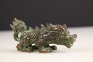 A traditional Chinese ornamental bronze lion figure.