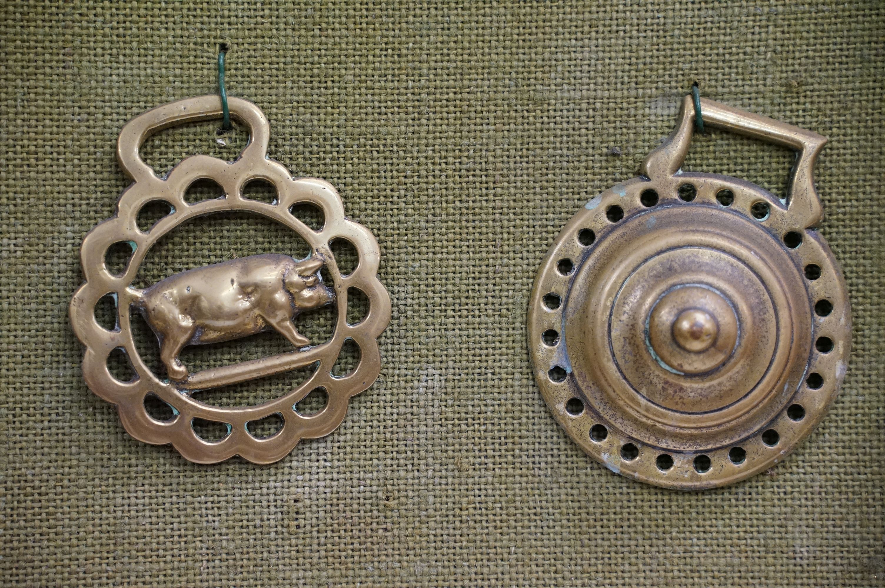 Collection of antique horse brasses mounted to canvas covered board and framed. Measures 97 x 66cm. - Image 9 of 11