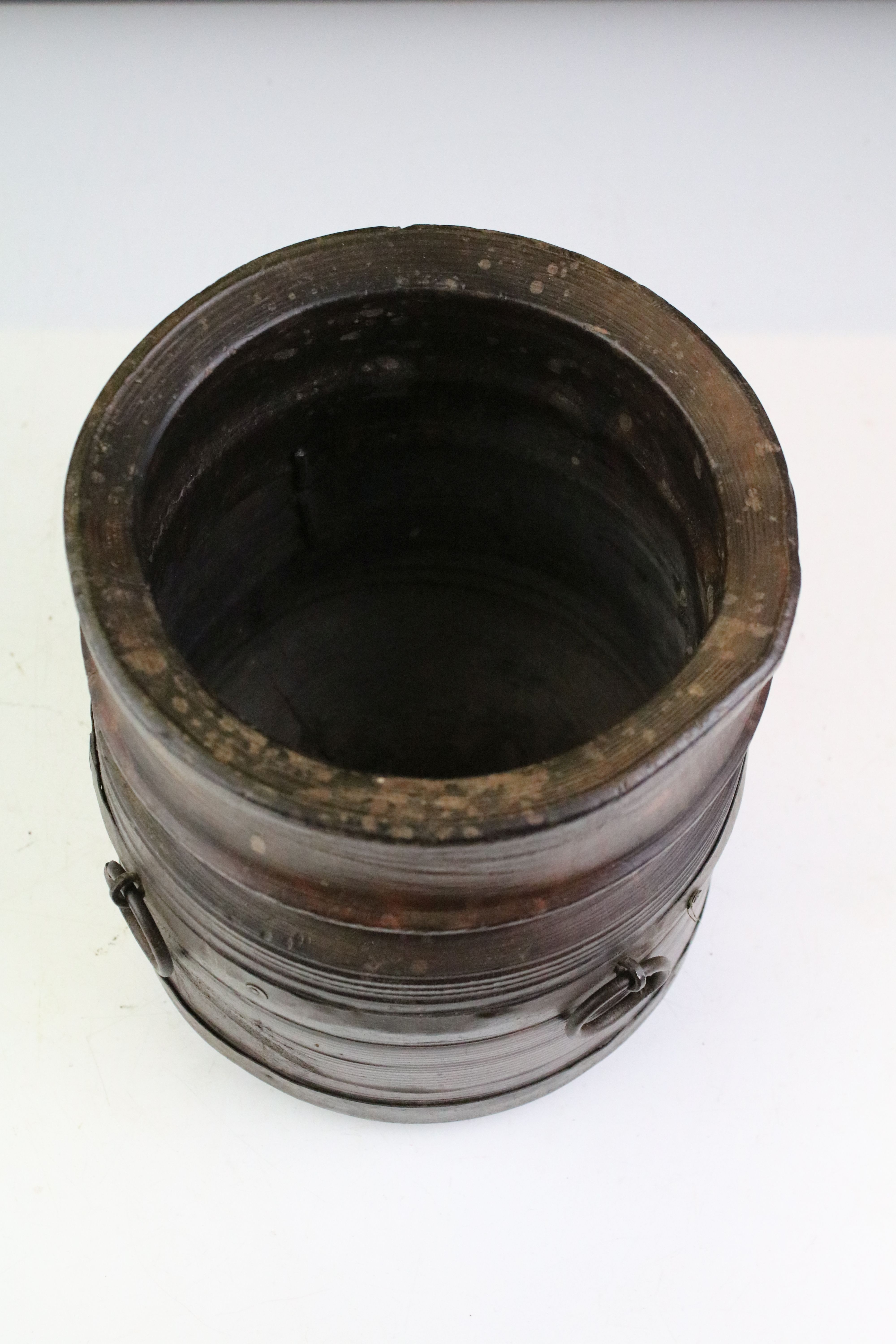 19th Century turned wooden pot having three cast metal ring handles. Measures 19cm tall. - Image 2 of 3