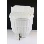 Ceramic wall mounting wine flagon dispenser having a moulded basket weave exterior with tap to base.