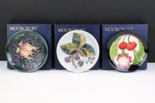Three Moorcroft small round dishes to include Cluny, Bramble and one marked trial 8.4.13. All boxed.