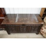 17th Century oak coffer chest having three carved panels to front each with foliate design beneath a