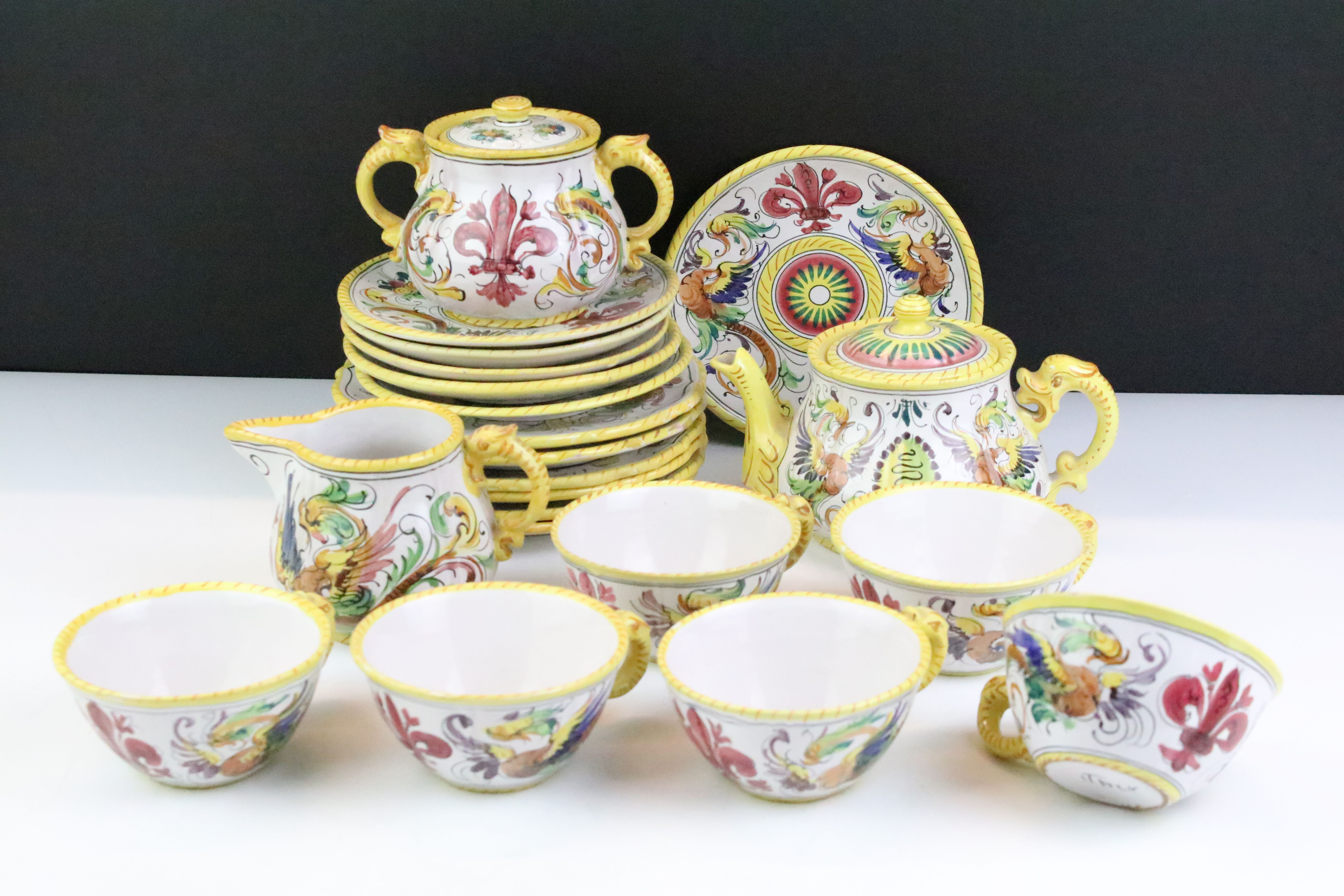 Italian faience tea set with scrolling & floral decoration and yellow border, the lot to include