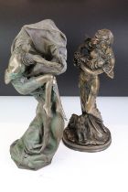 Two 20th Century cast resin faux bronze figurines in the form of a female figure holding a basket of