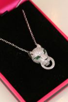 Silver and CZ designer style pendant necklace with emerald eyes