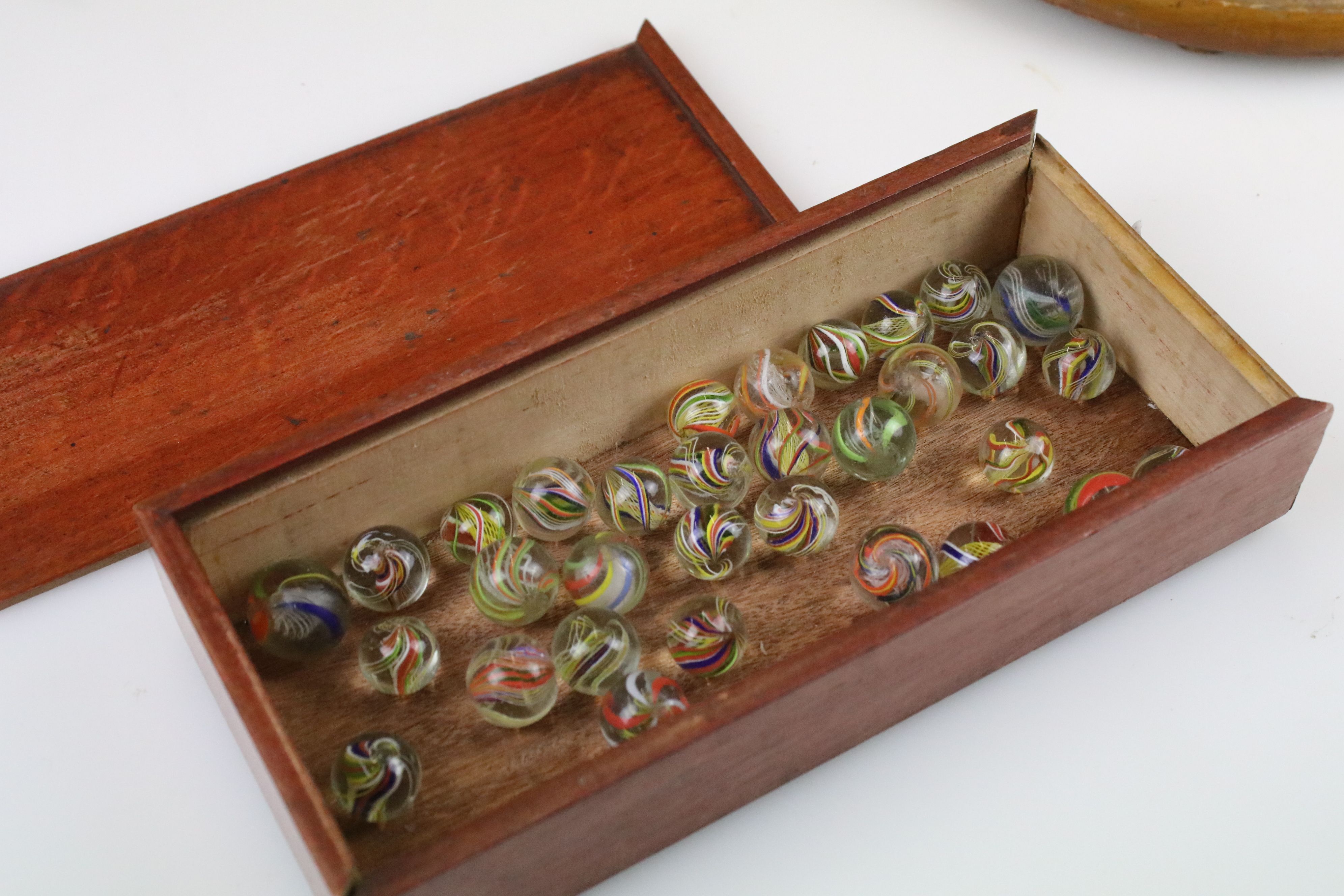 An antique carved wooden solitaire board complete with antique marbles. - Image 4 of 4