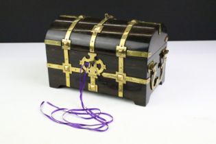 19th Century coromandel wood dome lid casket box with brass banding and silk lined interior.