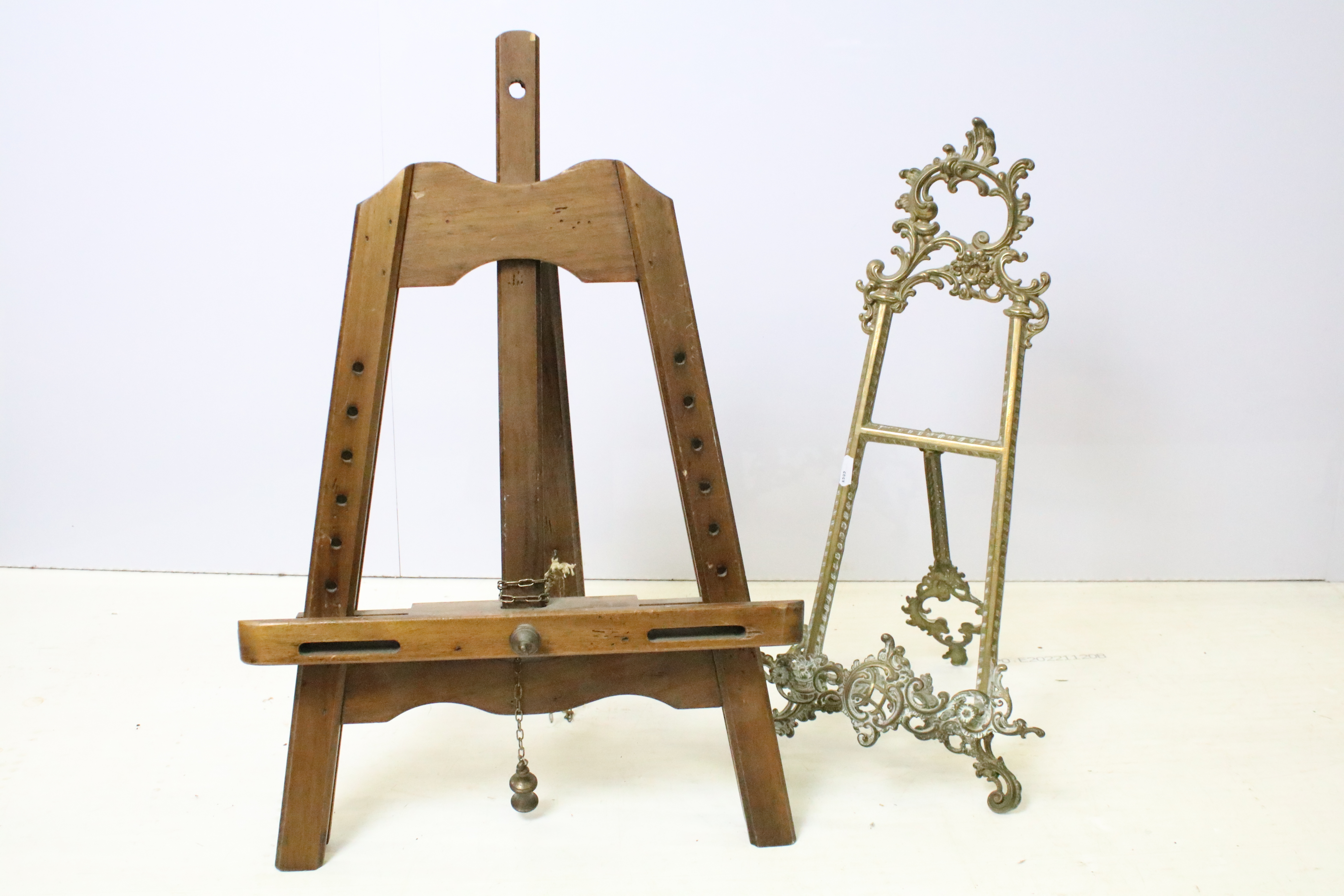 19th Century brass table top picture easel together with an adjustable wooden table top easel.