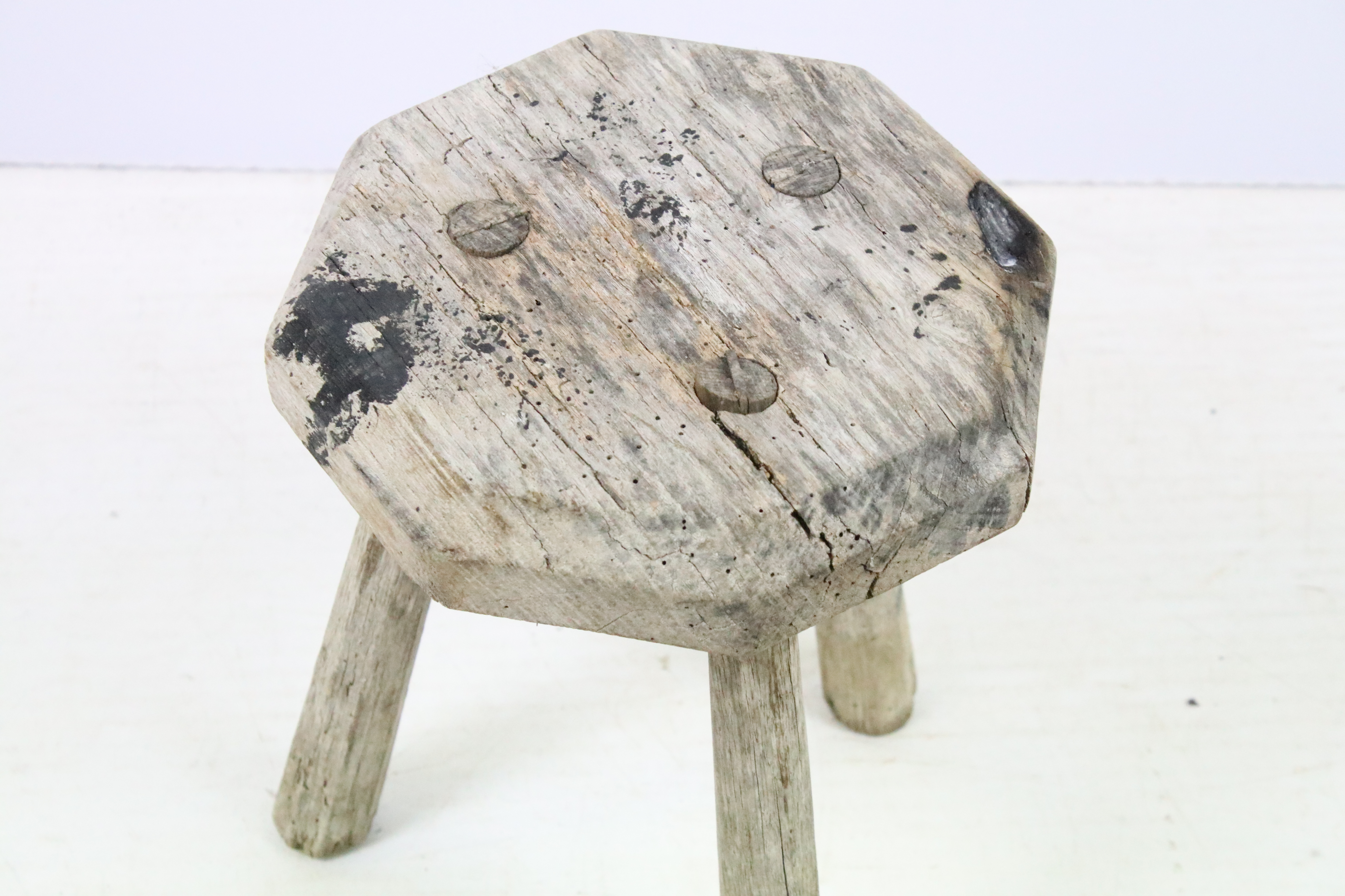 Weathered elm three legged milking stool with octagonal top. Measures 34cm tall. - Image 2 of 4