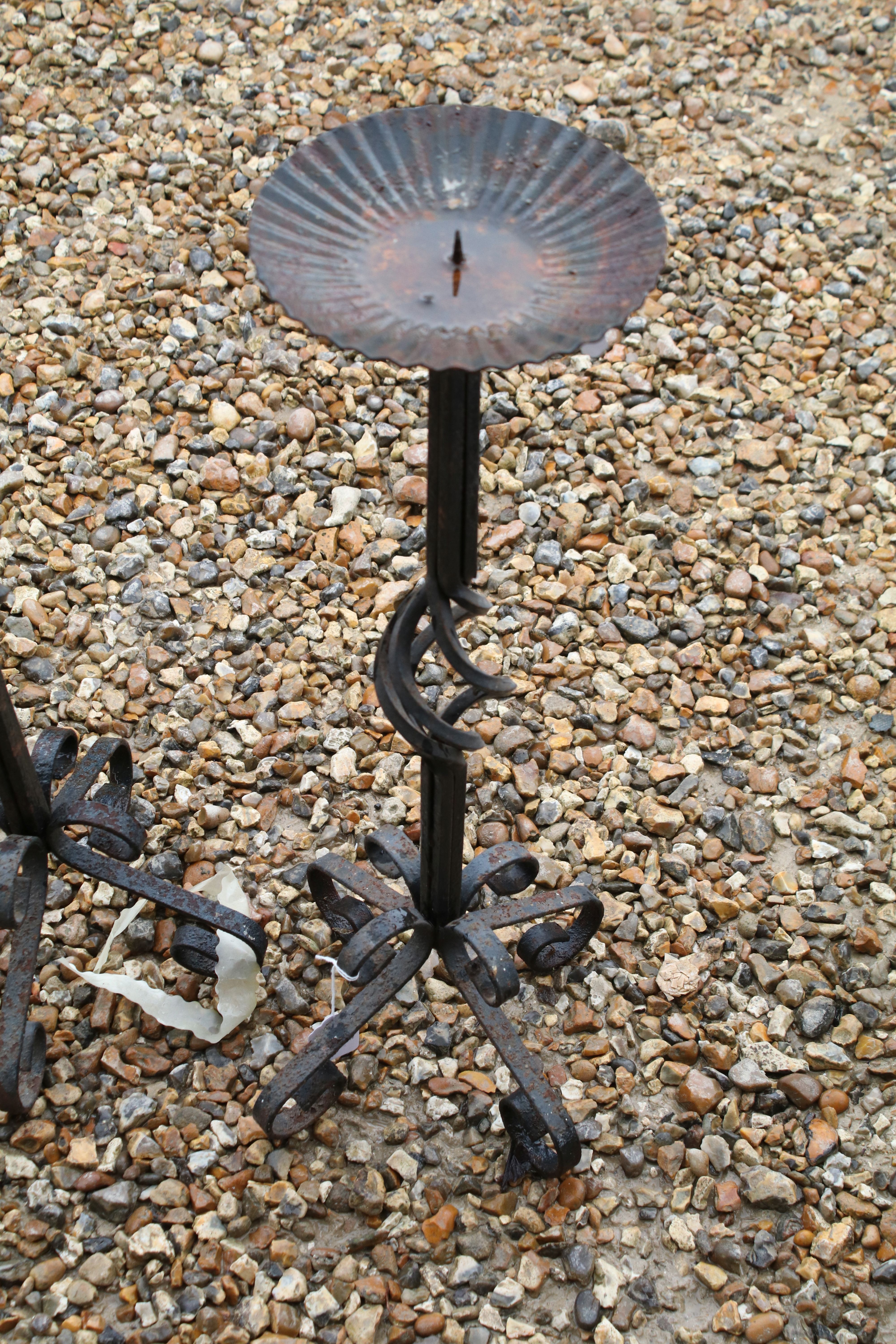 Set of three wrought iron floor standing candlesticks with spiralling to support, approx 62cm high - Image 2 of 4