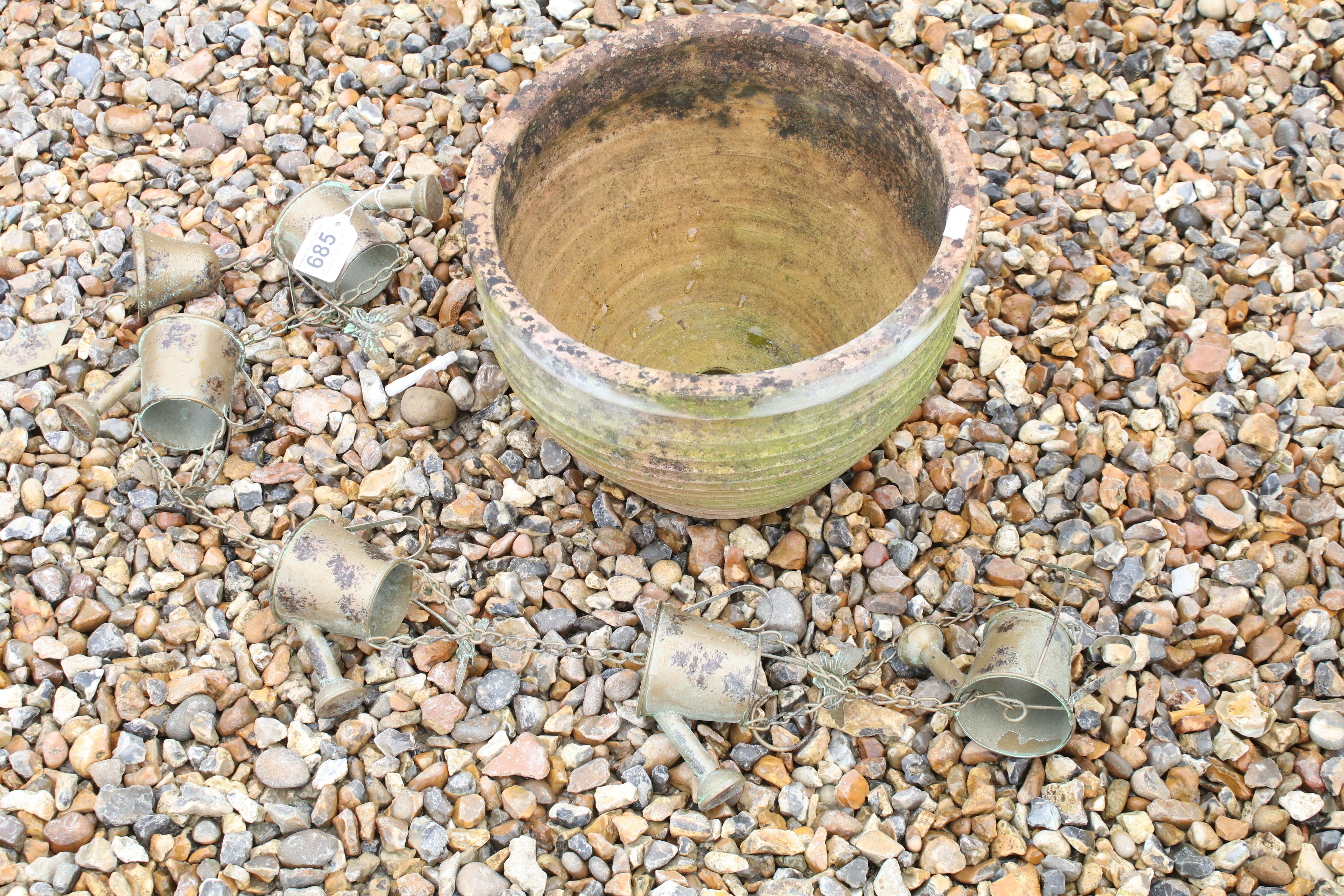 Terracotta garden planter (approx 30cm diameter), together with a hanging watering can garden