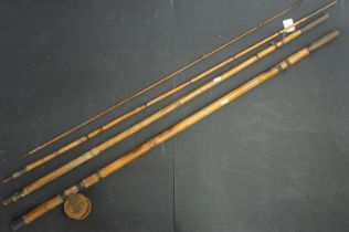 Early 20th Century bamboo fishing rod with attached reel. Reel unmarked.