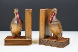 Pair of Art Deco carved oak bookend modelled as birds, with cherry Bakelite details, approx 15cm