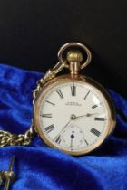 A gold plated waltham pocket watch together with albert chain.