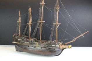 20th Century wooden boat model having hand painted details with rigging, life boats and cannons.