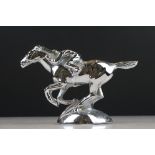 A nickel plated white metal trophy in the form of a horse and jockey.