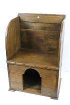 Late 19th Century oak lambing chair with kennel below